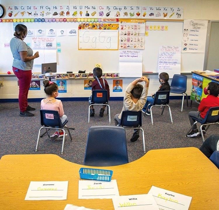 Mrs. White teaching the class.